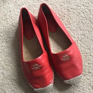 Women’s leather Coach slip ons